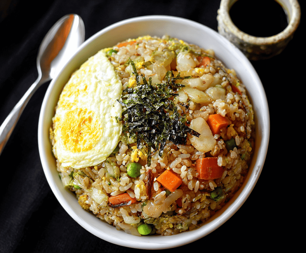 Delicious Japanese Fried Rice with vegetables and scrambled eggs served hot.