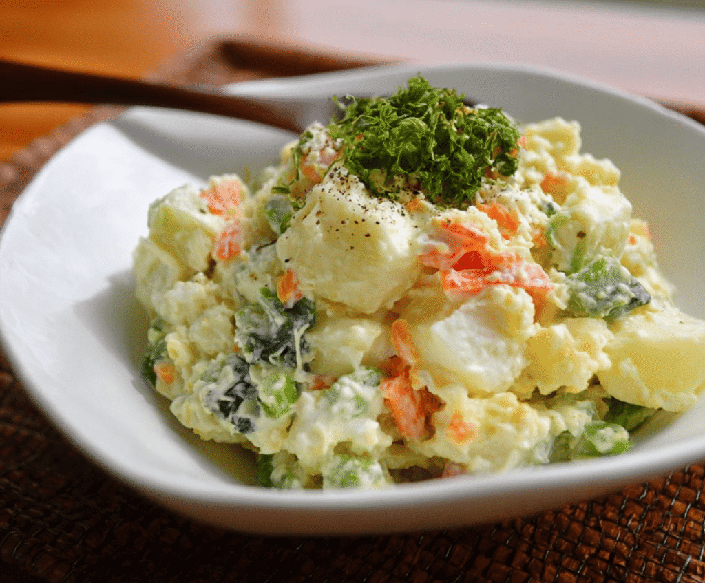 Delicious Japanese potato salad with fresh vegetables and creamy dressing, perfect for a light meal or side dish.