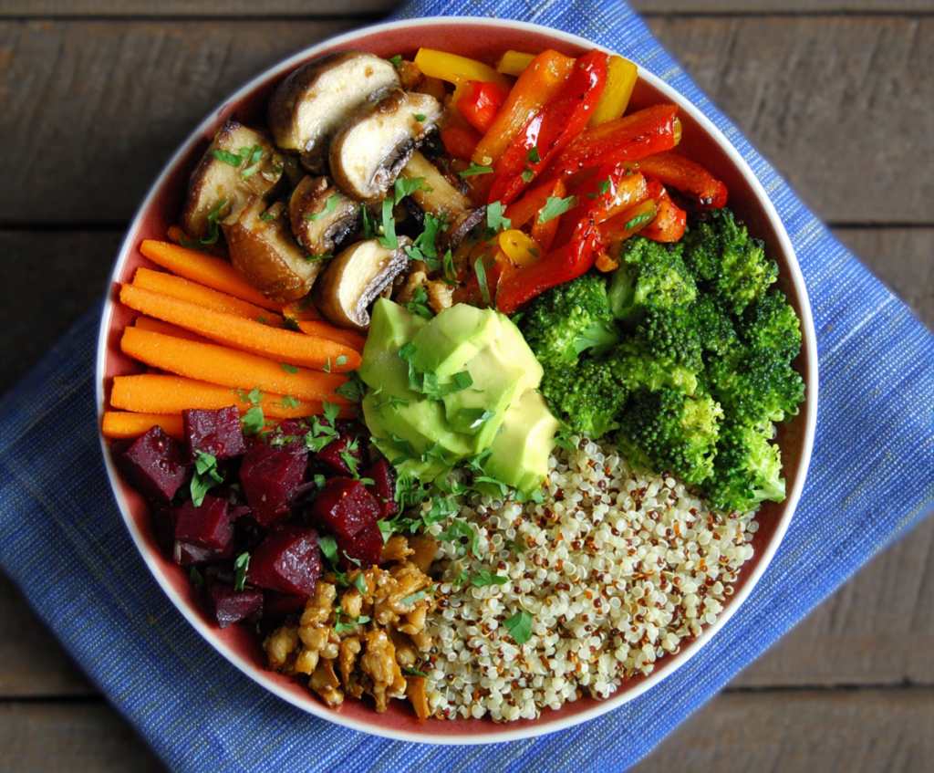 Colorful clean eating quinoa veggie bowl with fresh vegetables and herbs for a healthy meal.