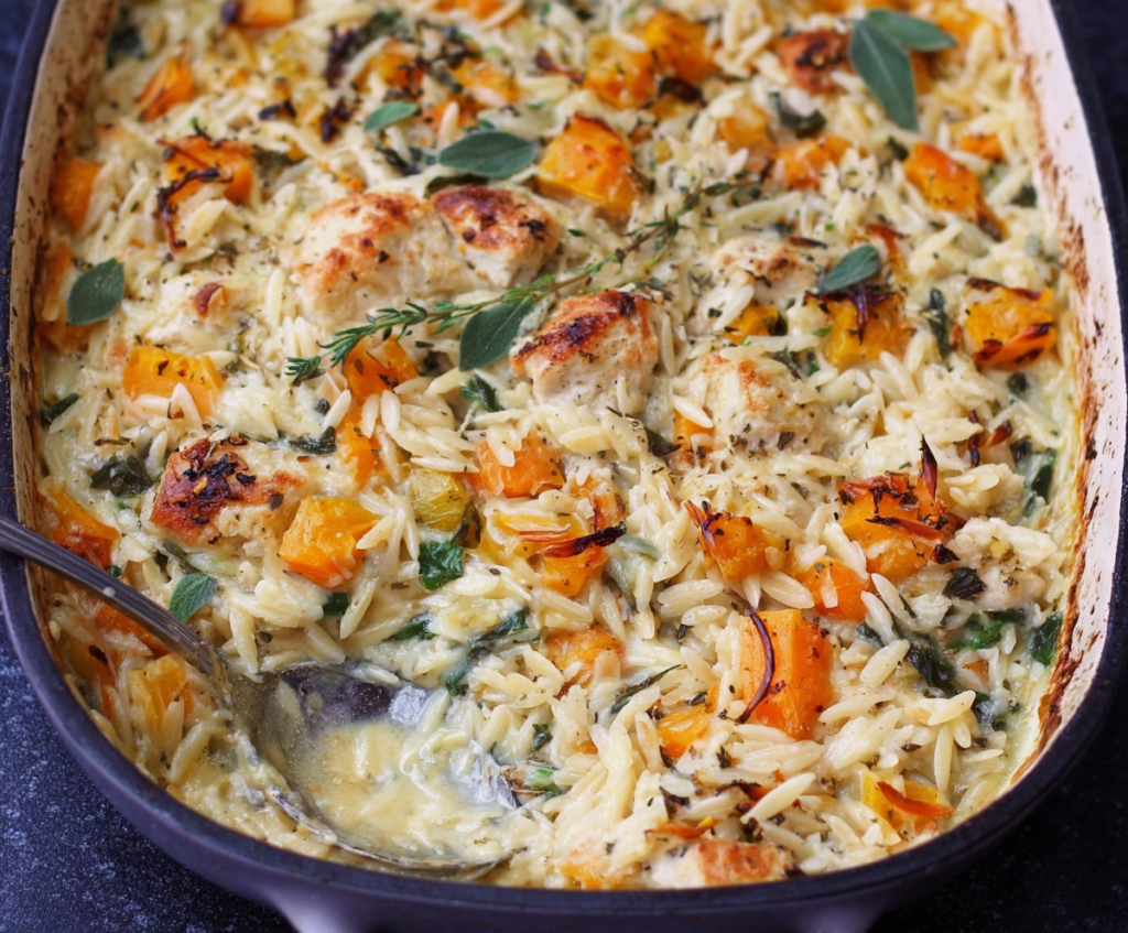 Creamy Boursin orzo bake with tender chicken and colorful vegetables in a delicious casserole.
