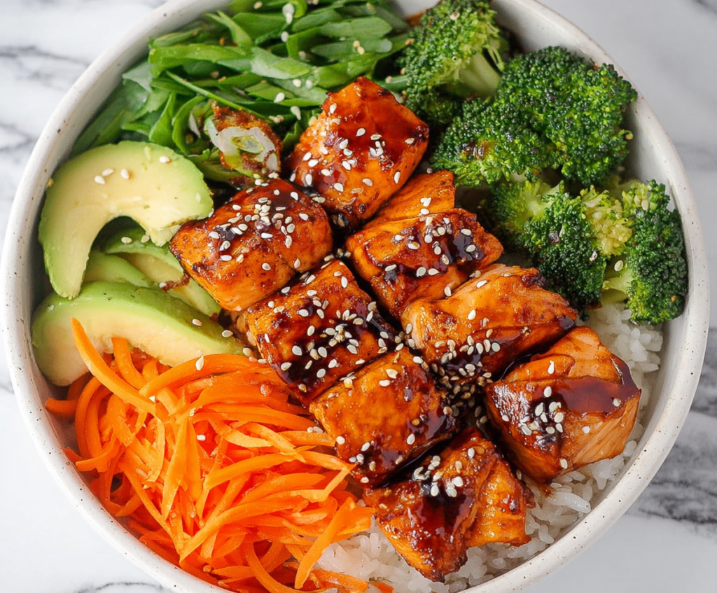 Delicious Teriyaki Salmon Bowls with fresh vegetables and rice, perfect for a healthy dinner
